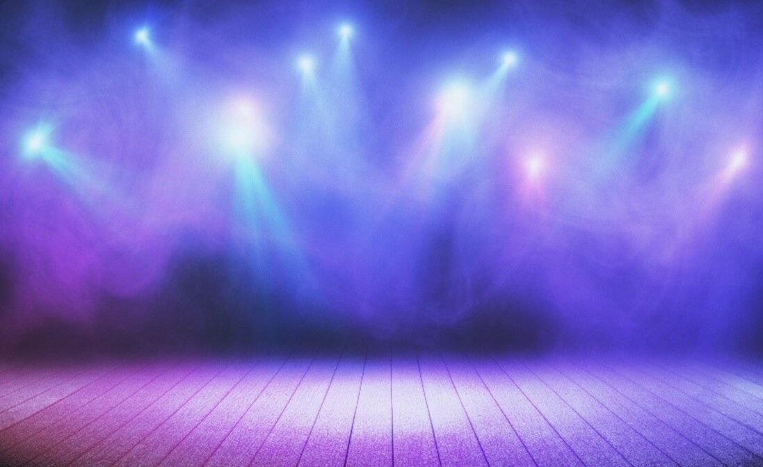 Purple spotlights on a stage.