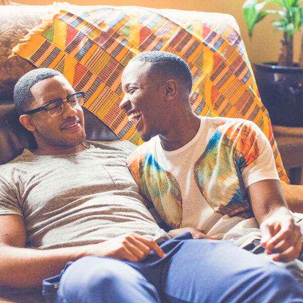 Two men sitting at a couch