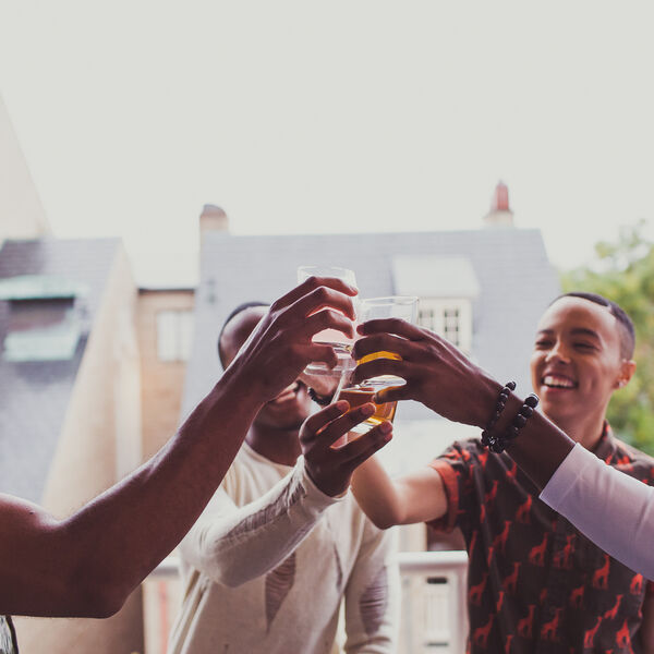 Four people celebrating.